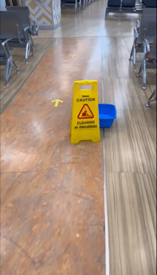 Caution signs at JKIA over leaking roof. According to a report by the Kenya Airports Authority in 2023, the leakage was due to downpipes being overwhelmed by the rains. Photo: Larry Madowo/X