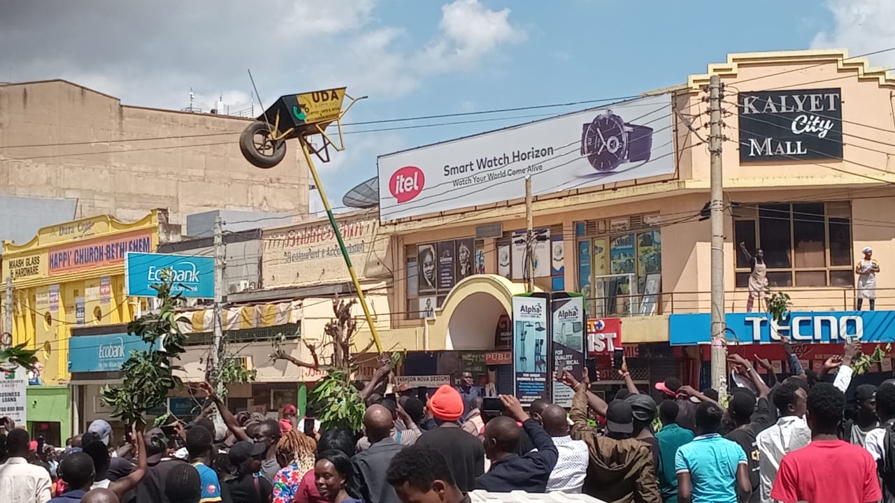 Angry residents pull down UDA wheelbarrows during anti-Finance Bill protests in Eldoret. PHOTO/TV47