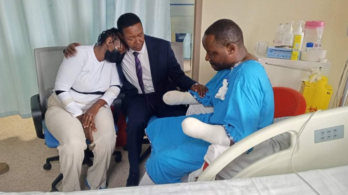 CS Alfred Mutua visits police officer who lost his hands while throwing teargas canister during protests in Nairobi