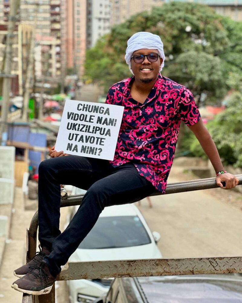 Abel Mutua carrying a placard during the anti-Finance Bill 2024 protests. Photo: Abel Mutua/Instagram