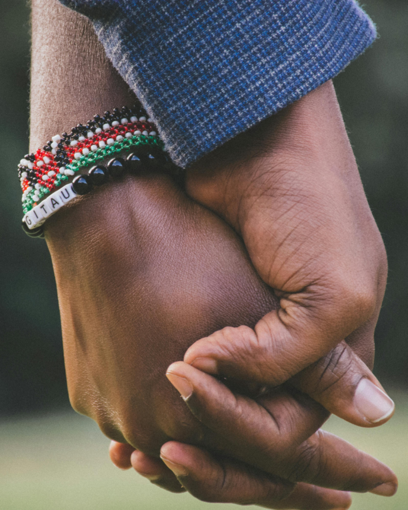 According to a sit down we had with one of the girls seeking to marry the son, they have not yet lost hope that one day he might make up his mind. Photo; Kenyan couple holding hands/ Pexel; Git Stephen Gitau.