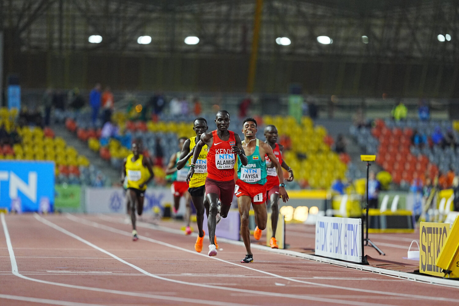 Andrew Alamisi crossing the finish line to win the men's 5000m final at the World U20 Championships in Peru.