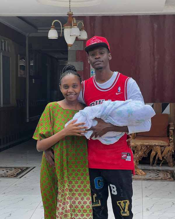 Content creator Warren with his girlfriend Whitney, and their new born baby