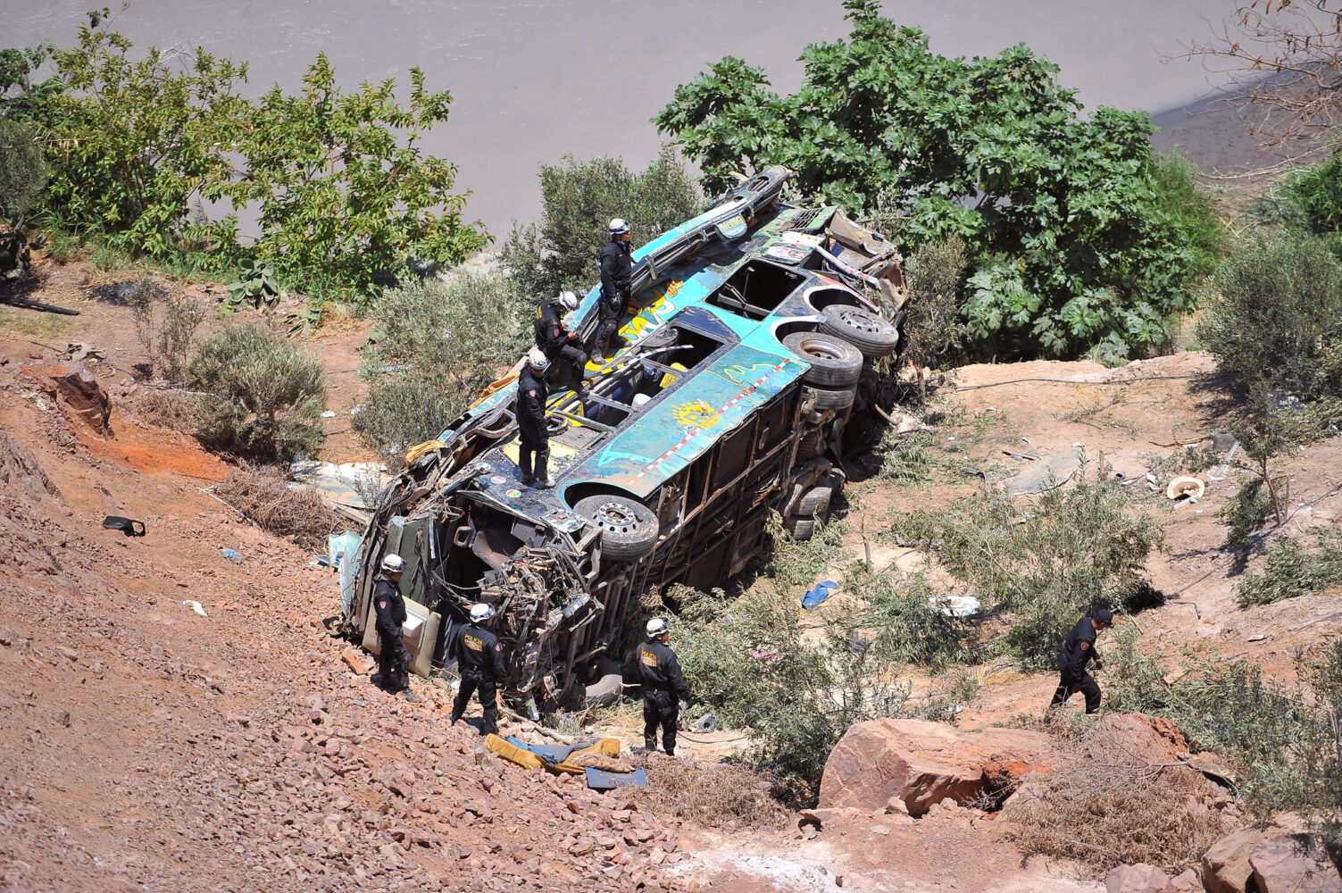 Bus transporting high school students plunges off a cliff, killing 11