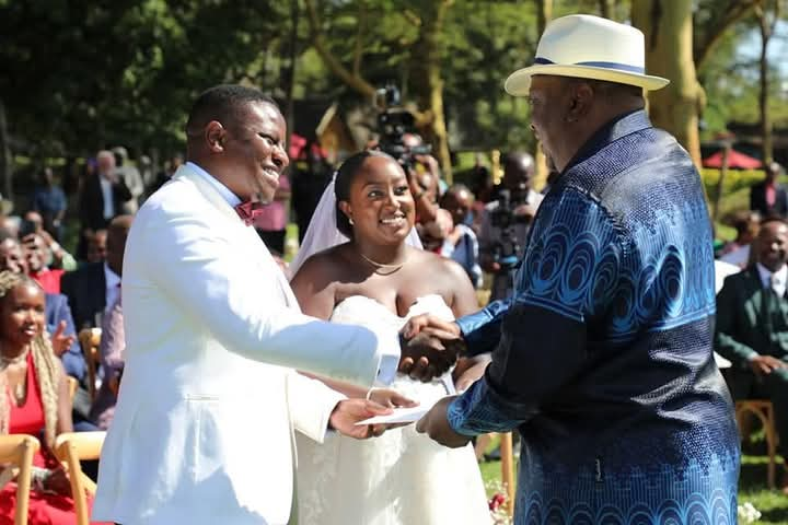 Former President Uhuru Kenyatta gifting the bride and the groom during their wedding ceremony on December 7, 2024.