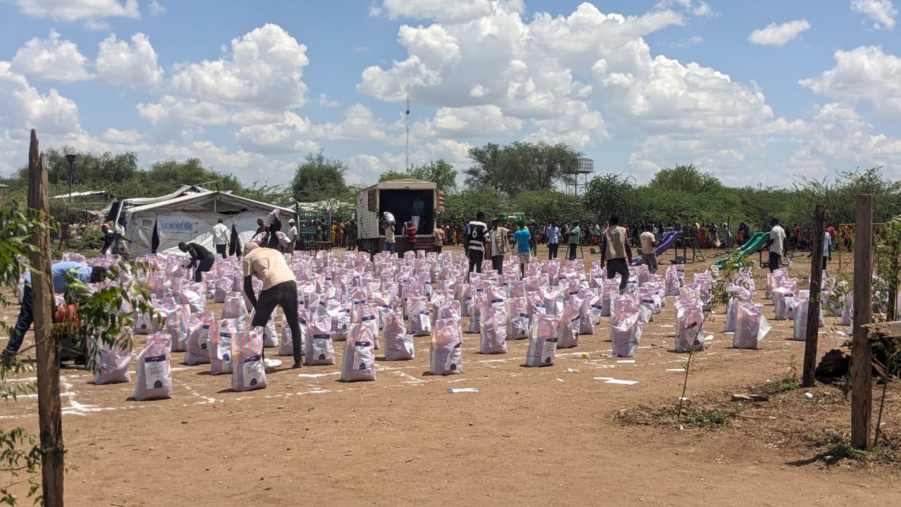 Refugees at Kakuma camp receive aid from donors. 